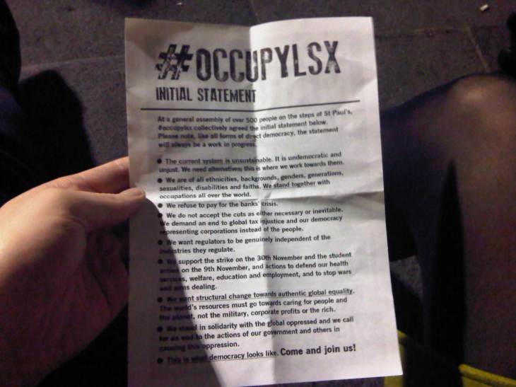 An A5 sheet of paper with the initial statement as composed and voted for by OccupyLSX.